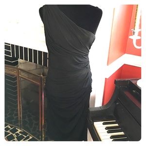 Black jersey one shoulder cocktail dress.